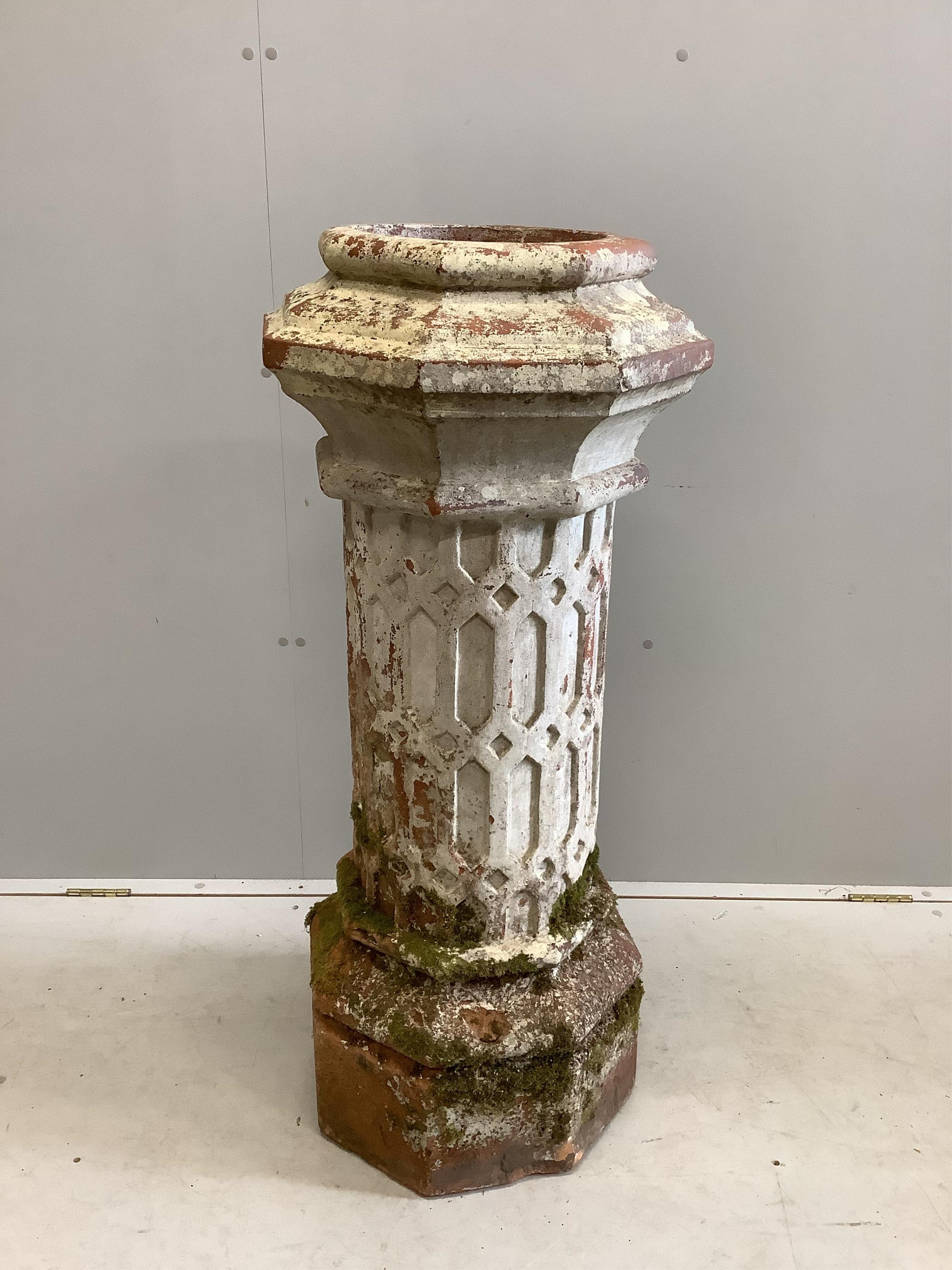 A large Doulton Lambeth style Victorian terracotta chimney pot with latticework decoration, c 1870, width 43cm, depth 43cm, height 110cm
